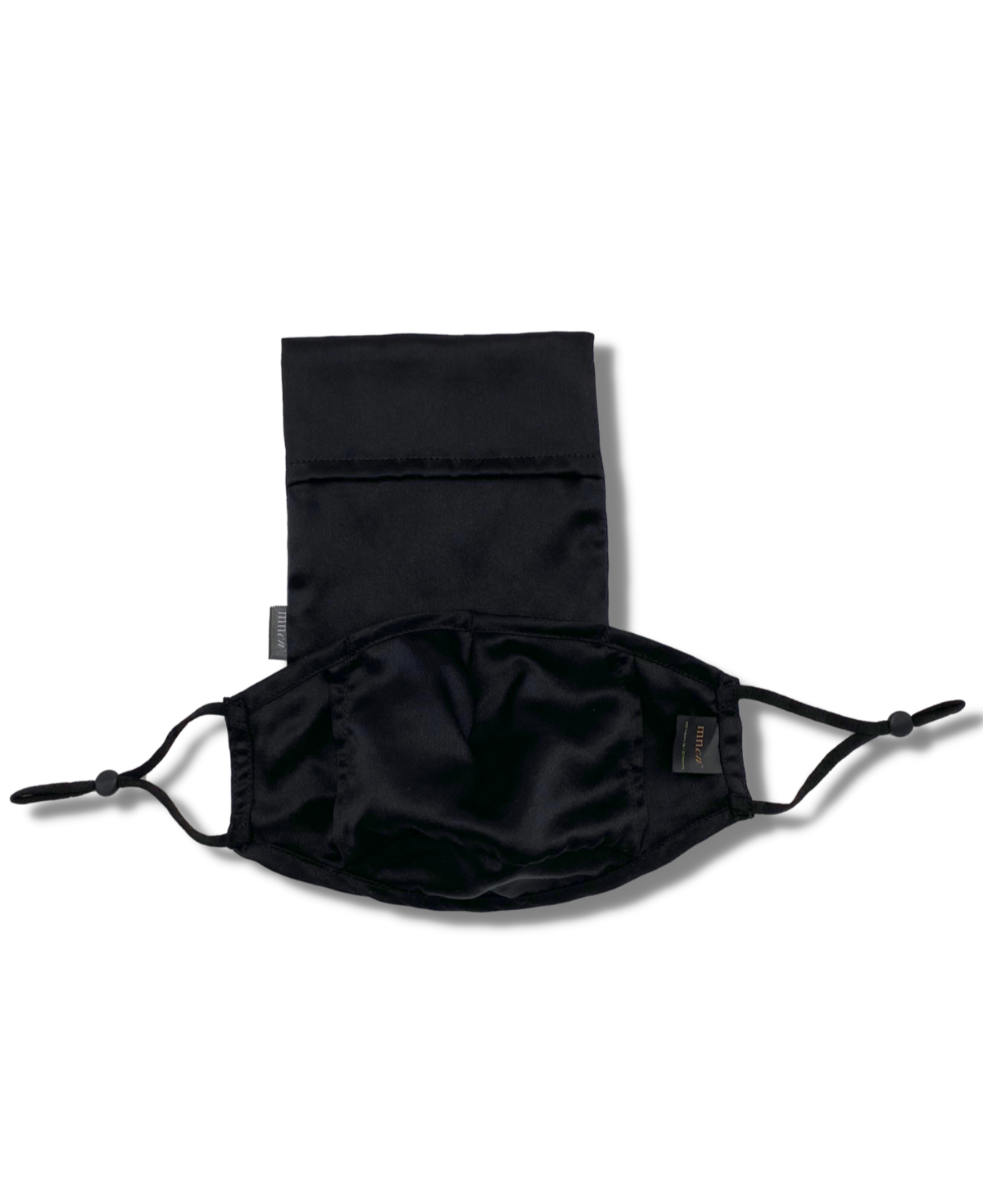 Black 22 momme mulberry silk mask. Our mask comes in a protective silk pouch. Midnight Cocoon based in the UAE.